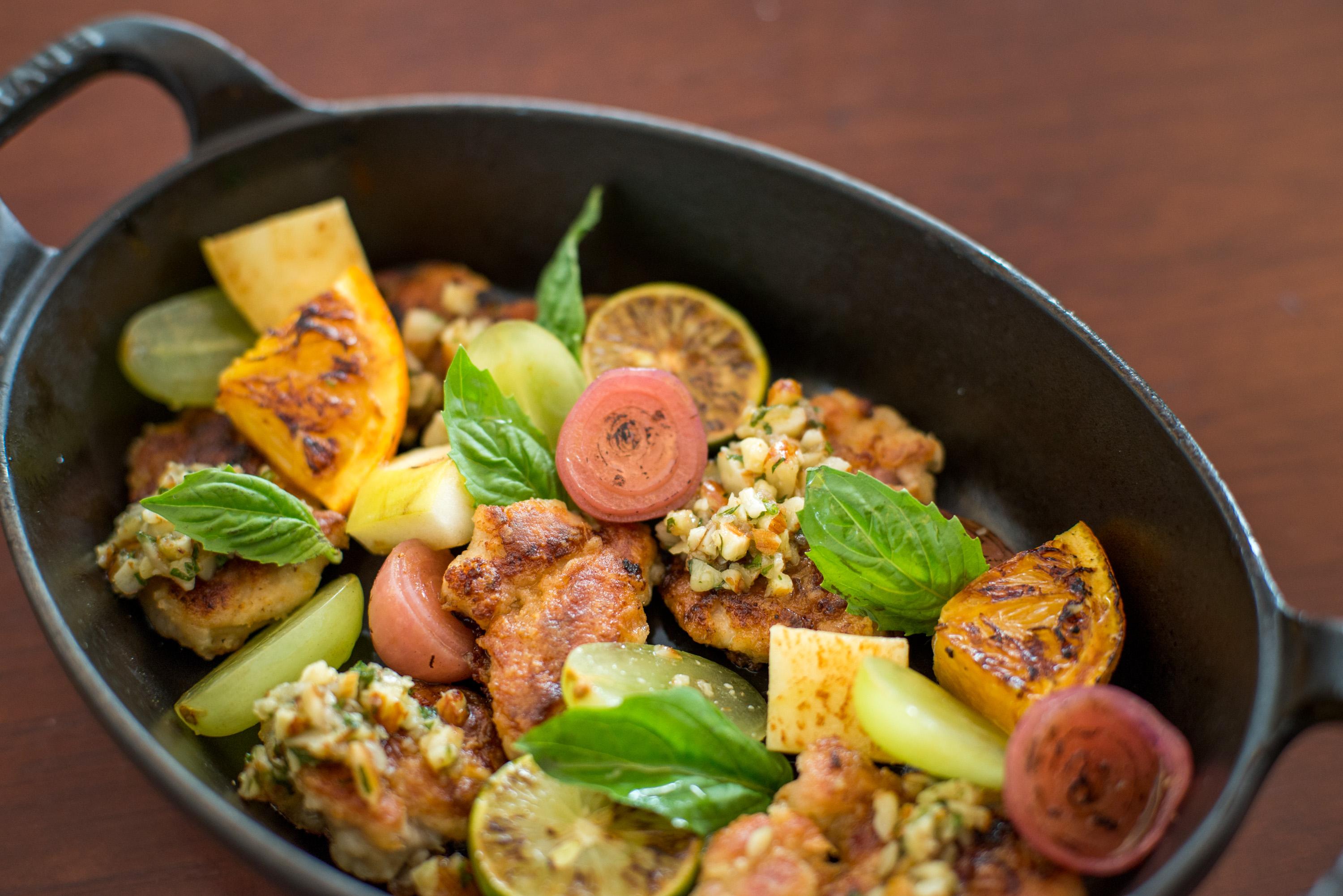 Dish of sweetbreads with vegetable garnishes